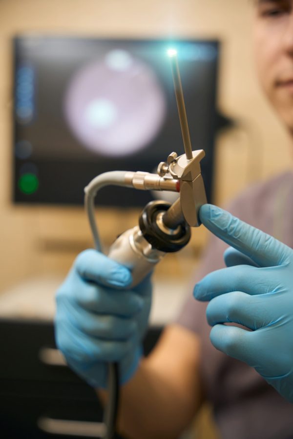 doctor-inspecting-medical-instrument-before-anosco-2024-10-18-18-03-12-utc